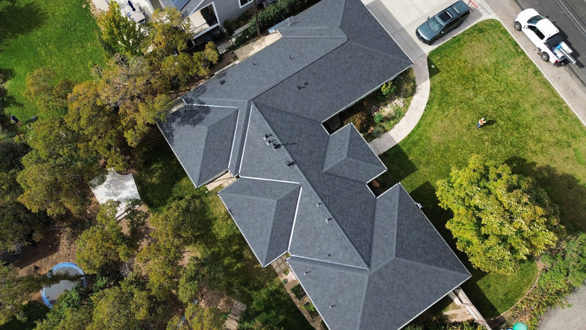 Aerial view of a full architectural shingle re-roof on a large Utah ranch-style home